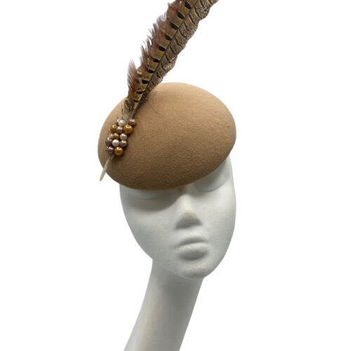 Tan felt headpiece with 2 large brown feathers with some coloured pearl detail to the base of feathers.